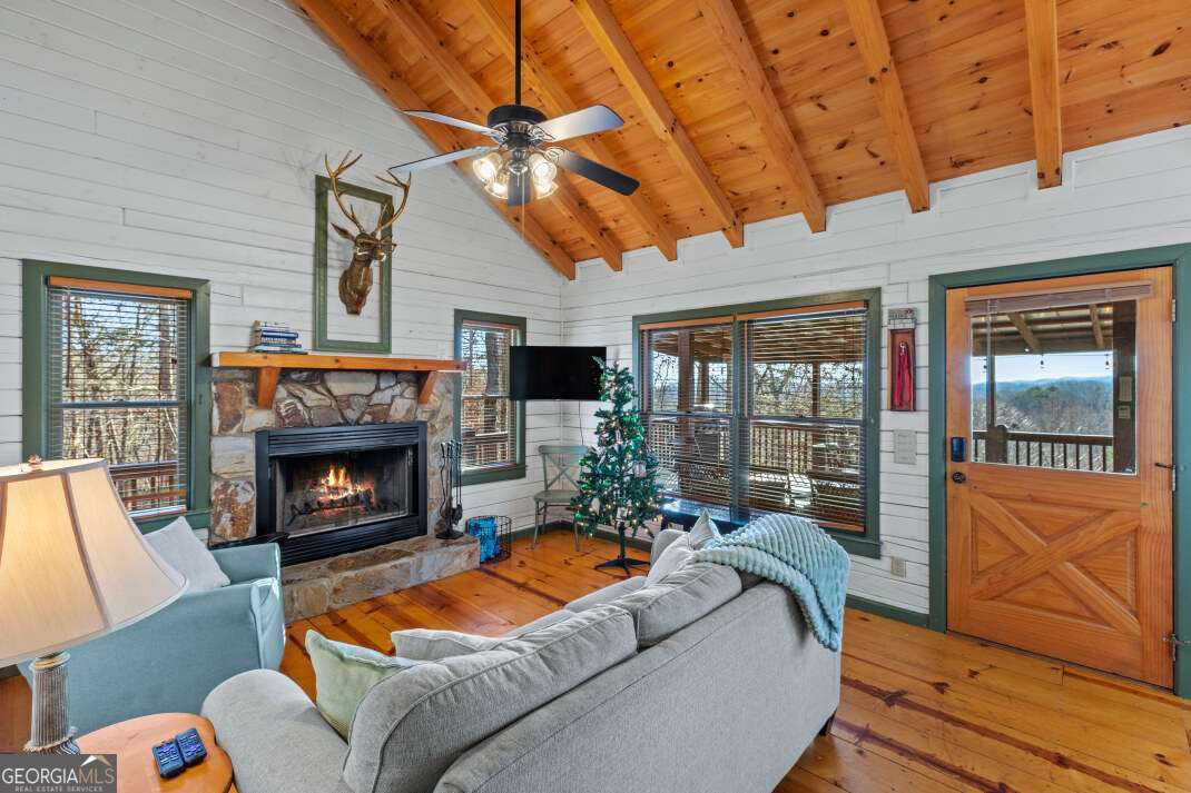 100 Smith Hill Road Blue Ridge, GA 30513 - Photo 15 of 66 a living room with furniture and a fireplace