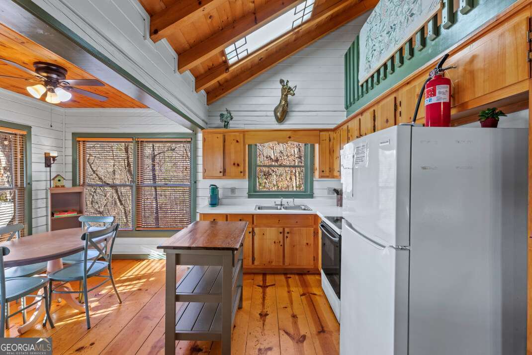 100 Smith Hill Road Blue Ridge, GA 30513 - Photo 16 of 66 a kitchen with stainless steel appliances granite countertop a refrigerator and a stove