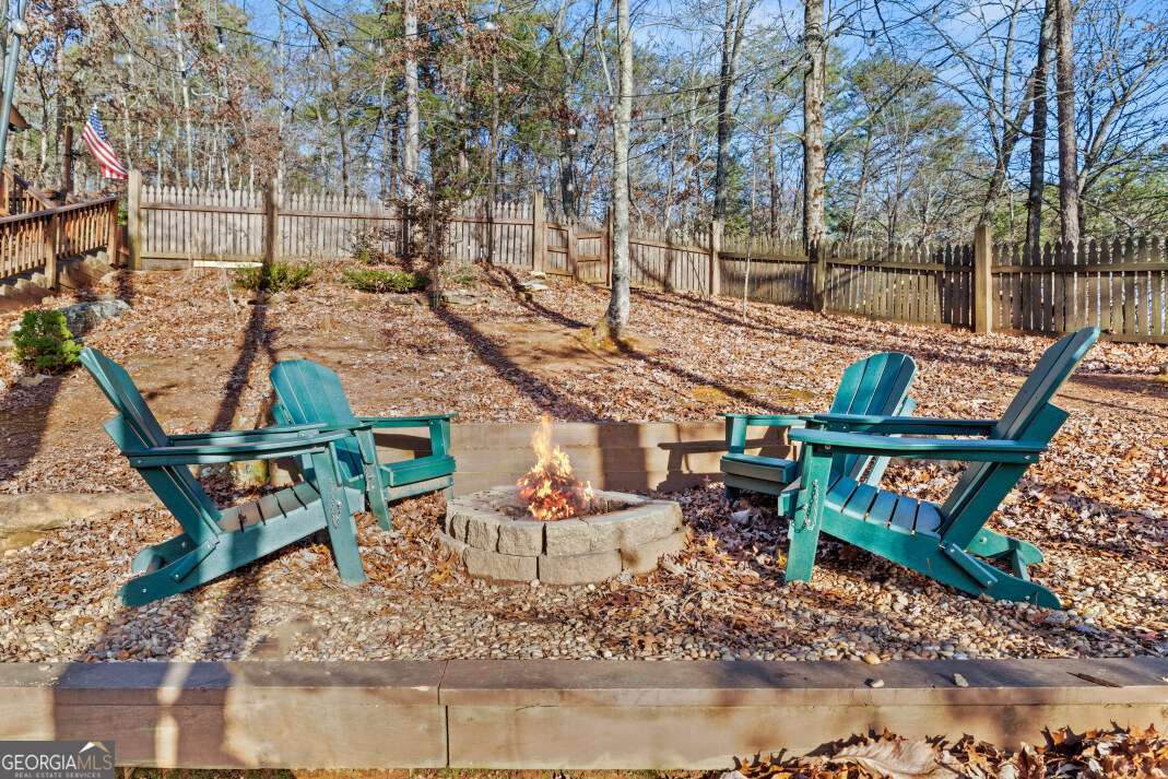 100 Smith Hill Road Blue Ridge, GA 30513 - Photo 40 of 66 a backyard of a house with barbeque oven