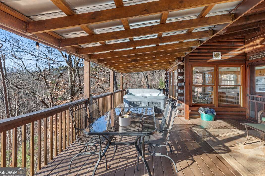 100 Smith Hill Road Blue Ridge, GA 30513 - Photo 4 of 66 a view of a chairs and table in the balcony