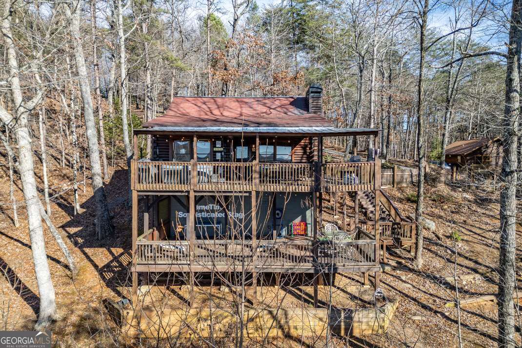 100 Smith Hill Road Blue Ridge, GA 30513 - Photo 44 of 66 front view of a house with a balcony