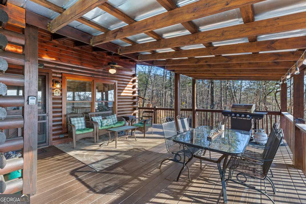 100 Smith Hill Road Blue Ridge, GA 30513 - Photo 7 of 66 a view of a patio with wooden floor
