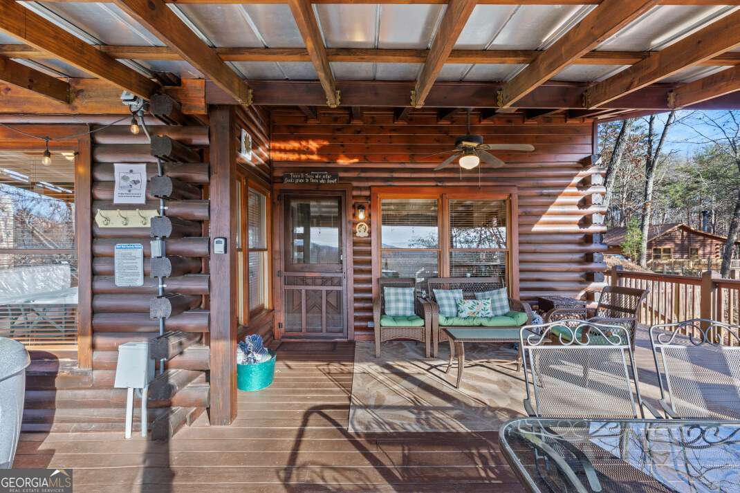 100 Smith Hill Road Blue Ridge, GA 30513 - Photo 8 of 66 a view of a porch with seating space