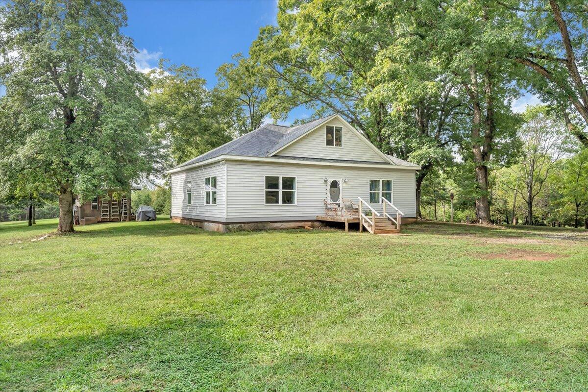 568 Moores Mill Road Ridgeway, VA 24148 - Photo 2 of 51 a front view of a house with a garden