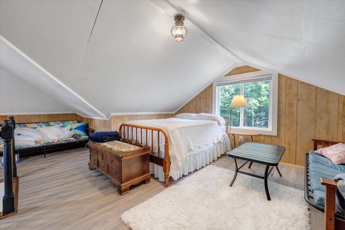 568 Moores Mill Road Ridgeway, VA 24148 - Photo 34 of 51 a bedroom with a bed and a chair