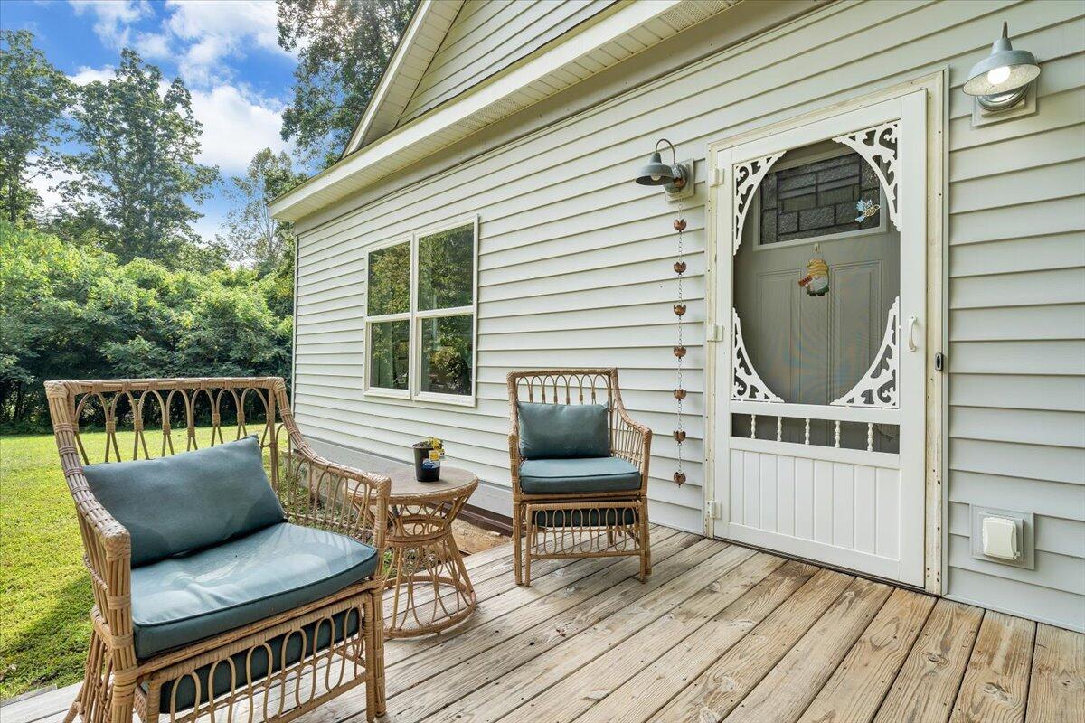 568 Moores Mill Road Ridgeway, VA 24148 - Photo 4 of 51 a view of a chairs in wooden deck