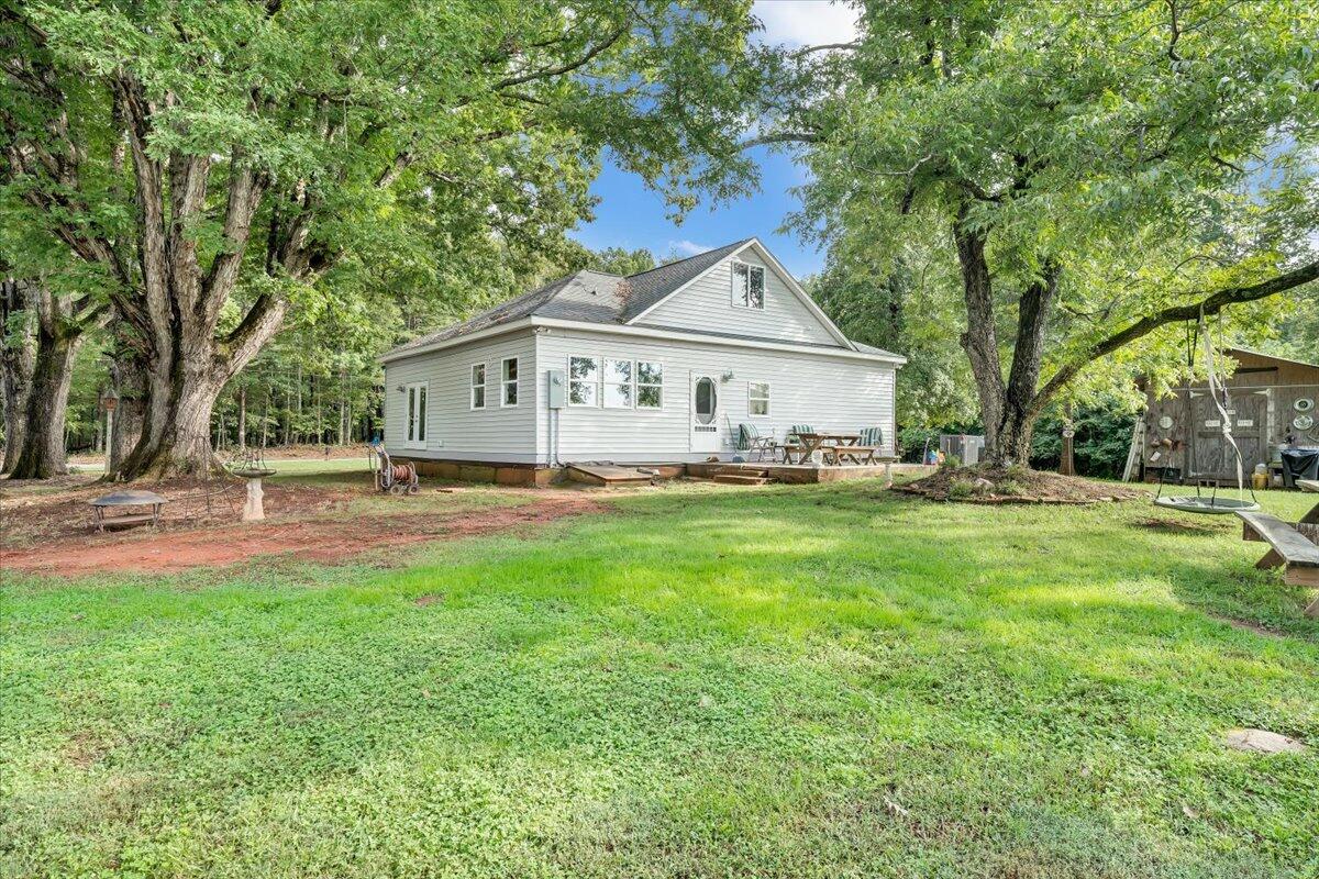 568 Moores Mill Road Ridgeway, VA 24148 - Photo 45 of 51 a front view of a house with yard and green space
