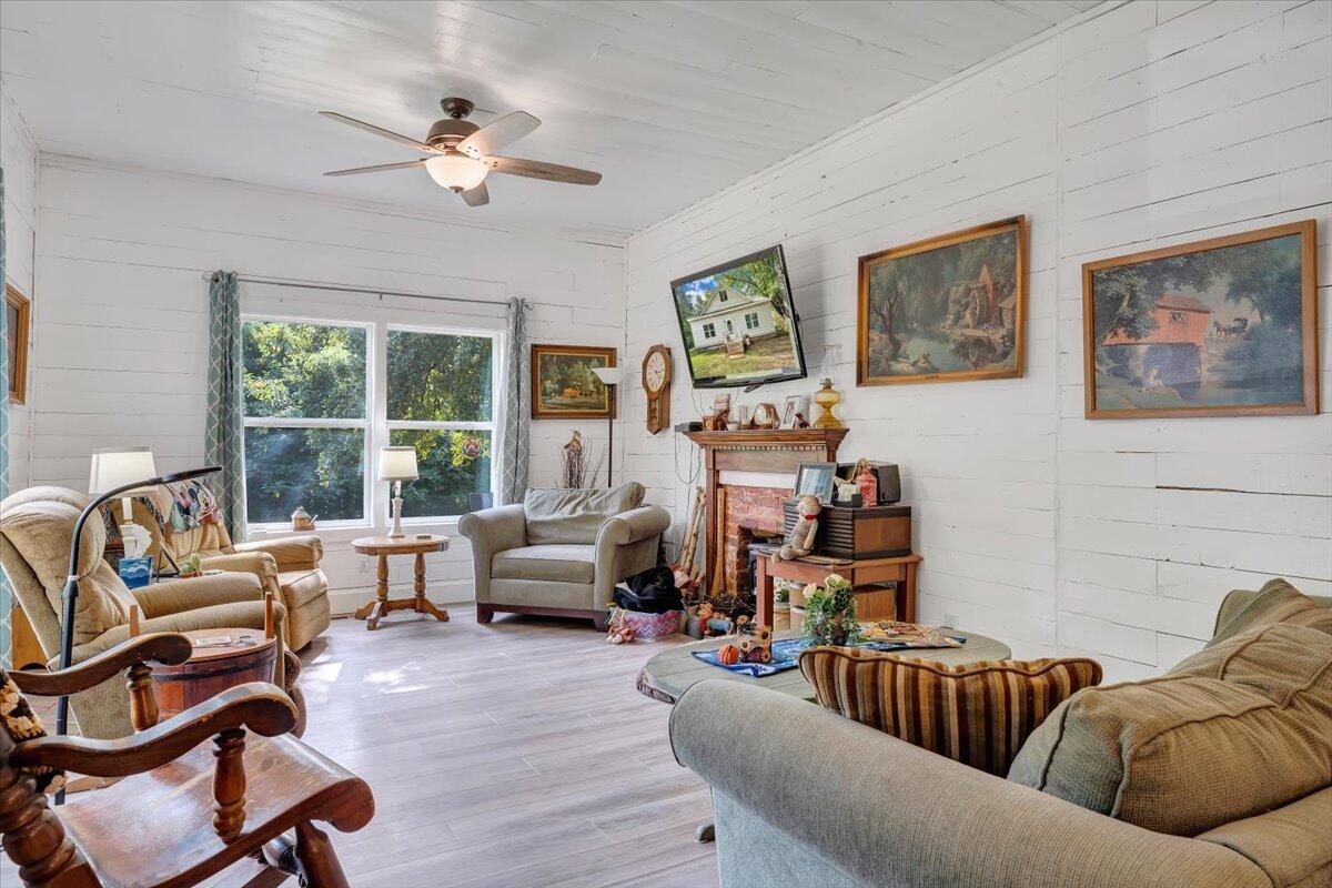 568 Moores Mill Road Ridgeway, VA 24148 - Photo 6 of 51 a living room with furniture or couch and a large window