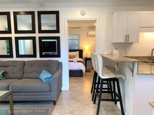 a bedroom with a large bed and a lamp