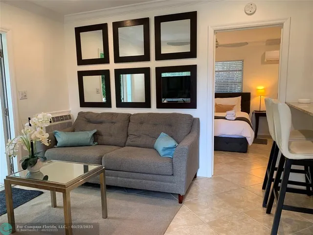 a view of a chairs and table in patio