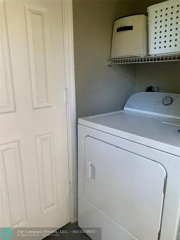 a kitchen with a sink appliances and cabinets