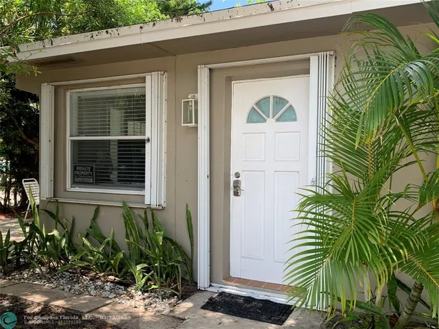 a kitchen with stainless steel appliances a refrigerator sink and cabinets