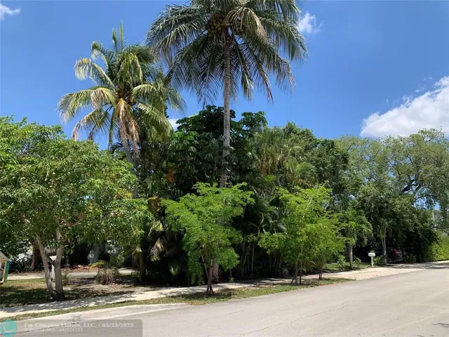 a bathroom with a sink a toilet and shower curtain