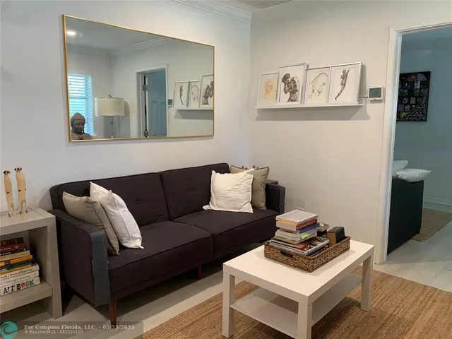 a kitchen with stainless steel appliances granite countertop a sink stove refrigerator and cabinets