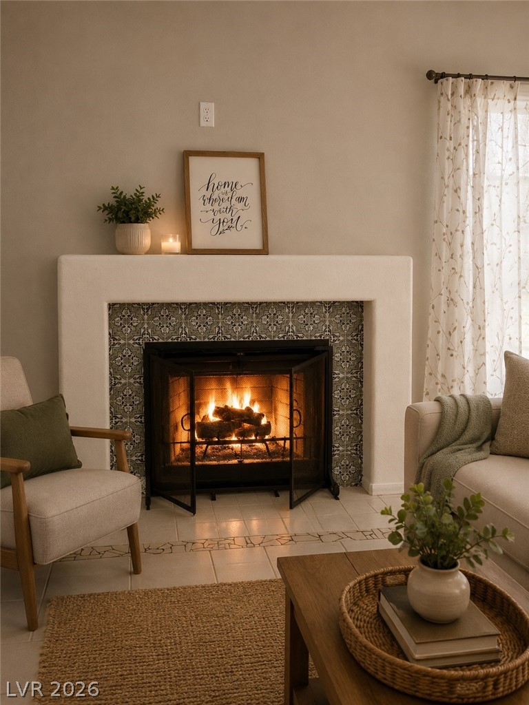 346 Seine Way Henderson, NV 89014 - Photo 3 of 24 A cozy living area centers around a fireplace with elegant tile surround, offering warmth and charm.