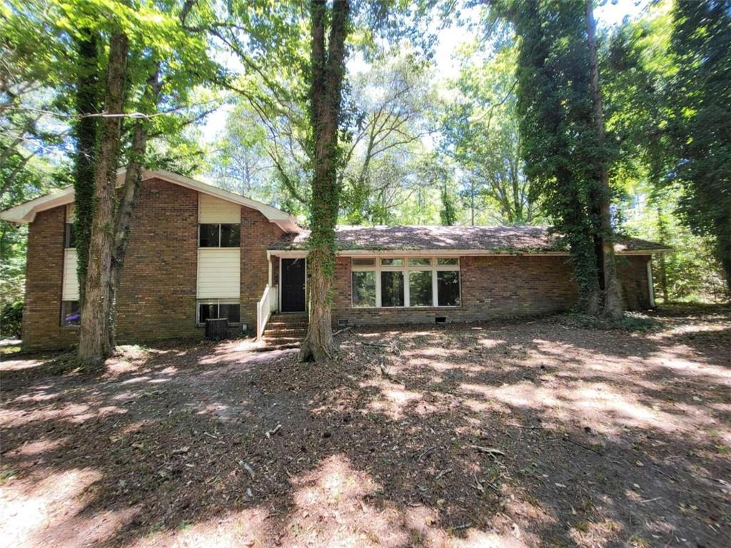 a view of a house with a tree