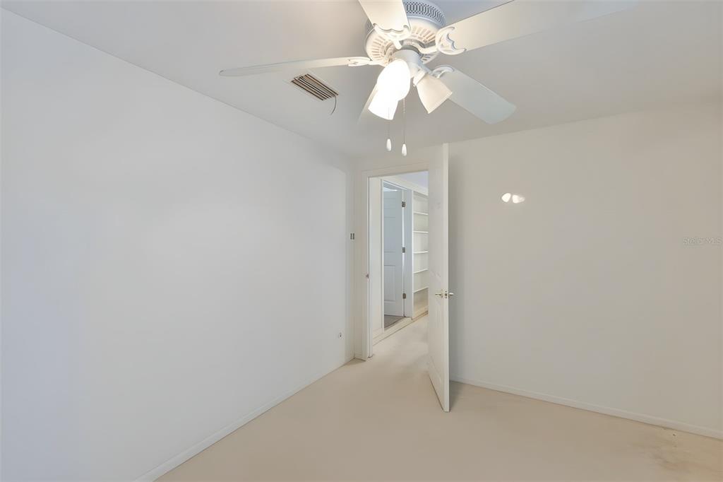 14451 Highland Road Wimauma, FL 33598 - Photo 62 of 80 wooden floor in an empty room