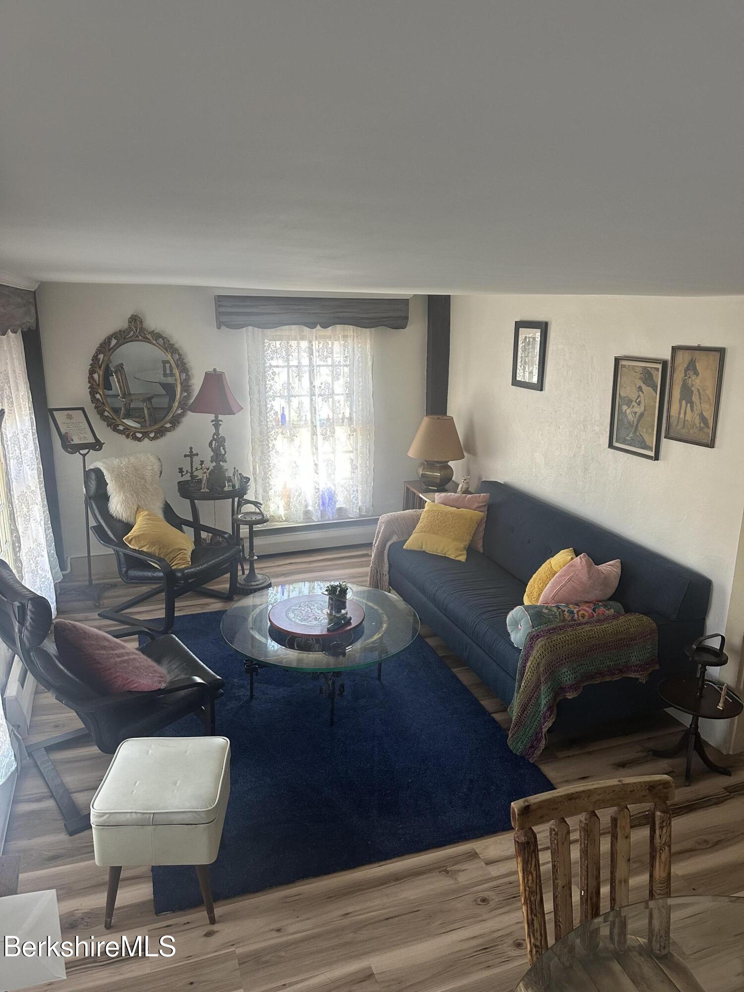 27 North Main Road Otis, MA 01253 - Photo 9 of 24 a living room with furniture and a large window