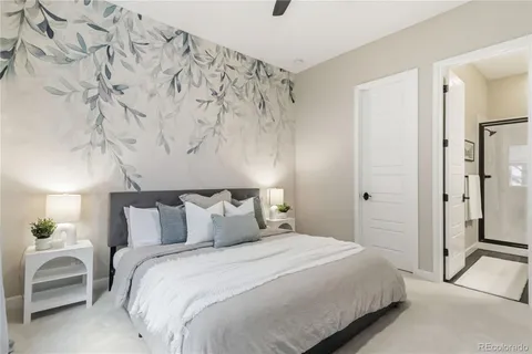 a bedroom with a bed and a chair