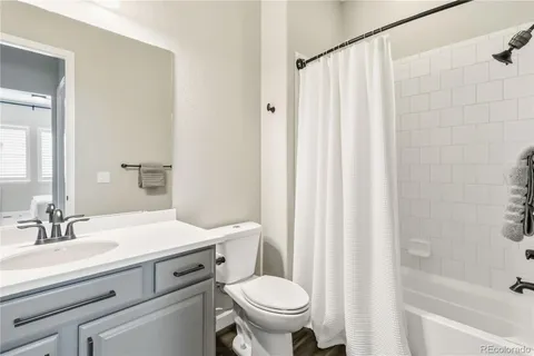 a bathroom with a sink a toilet and a bathtub