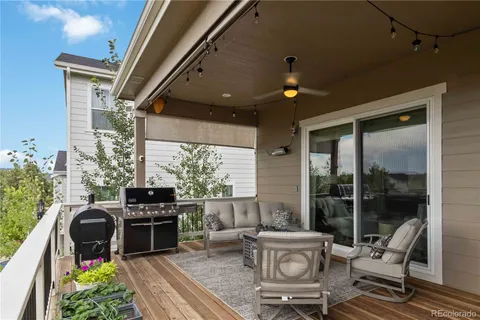 a living room with furniture a rug and a fireplace