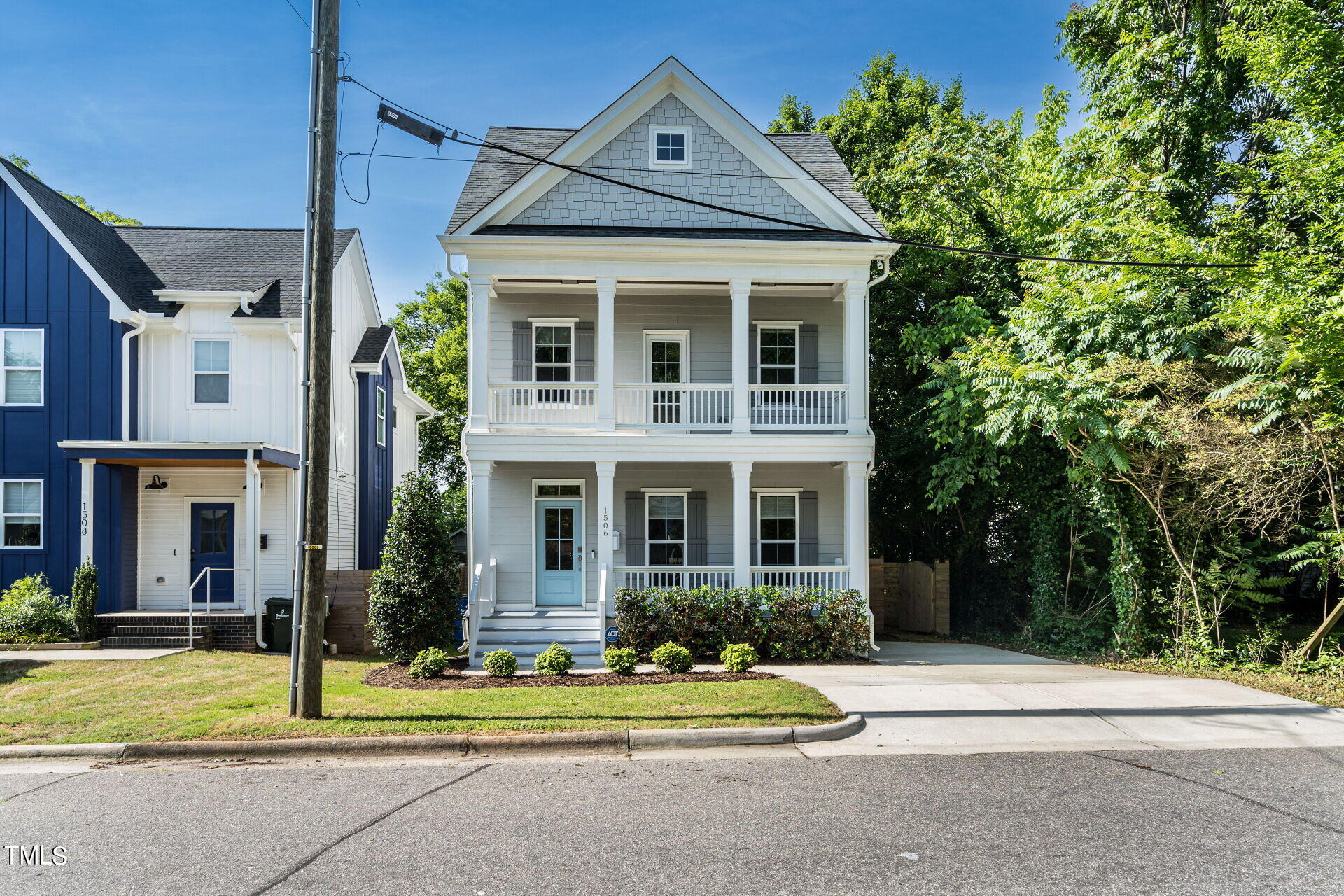 1506 East Jones Street Raleigh, NC 27610 - Photo 1 of 35 a front view of a house with a yard