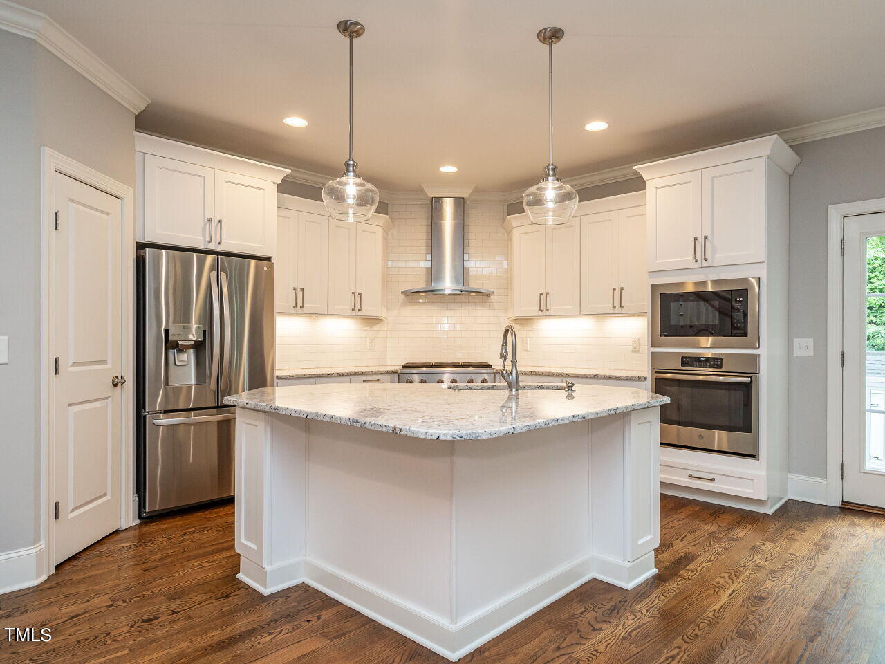 1506 East Jones Street Raleigh, NC 27610 - Photo 10 of 35 a kitchen with stainless steel appliances granite countertop a refrigerator a sink and a stove