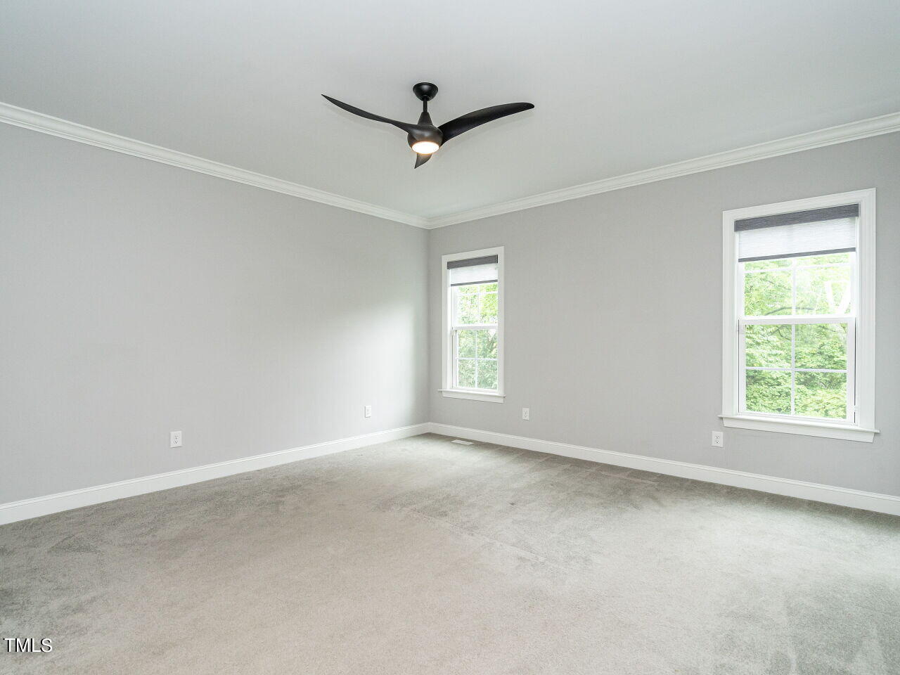 1506 East Jones Street Raleigh, NC 27610 - Photo 15 of 35 a view of a livingroom with a ceiling fan and window