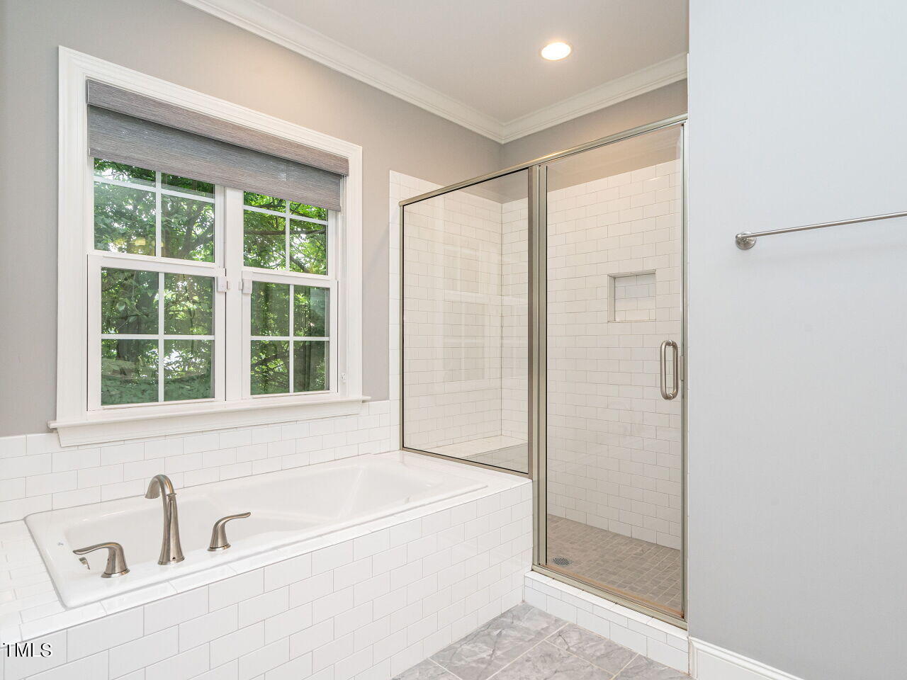 1506 East Jones Street Raleigh, NC 27610 - Photo 19 of 35 a bathroom with a bathtub and a shower