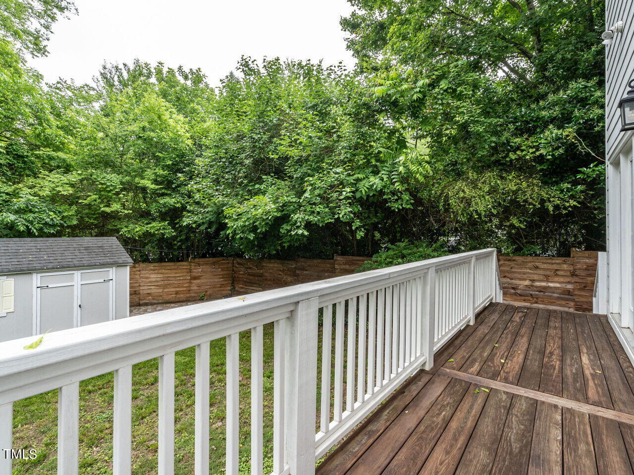 1506 East Jones Street Raleigh, NC 27610 - Photo 30 of 35 a view of balcony with wooden floor and fence
