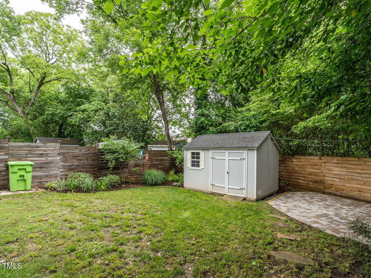1506 East Jones Street Raleigh, NC 27610 - Photo 31 of 35 a backyard of a house with lots of green space