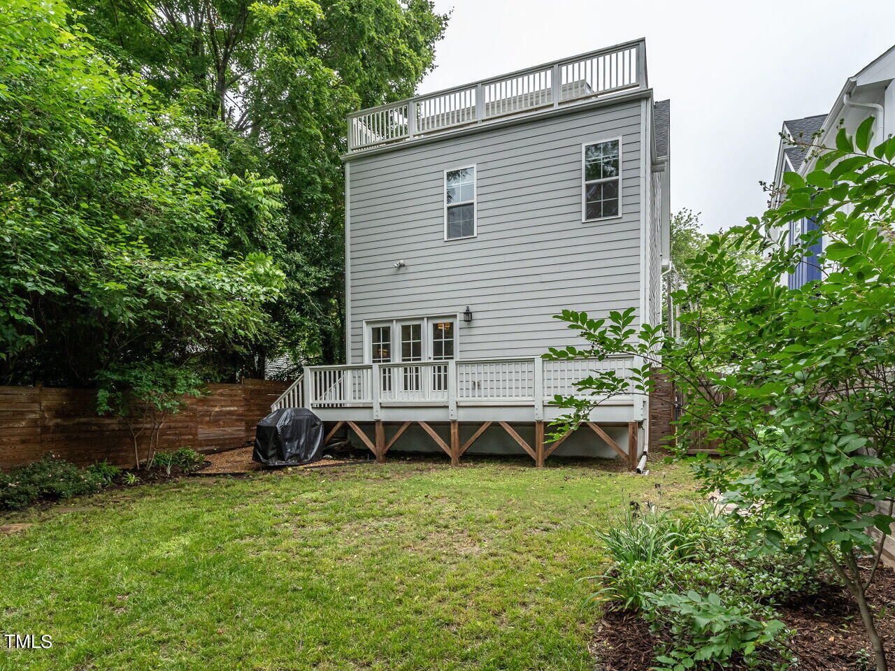 1506 East Jones Street Raleigh, NC 27610 - Photo 32 of 35 a view of a house with a backyard