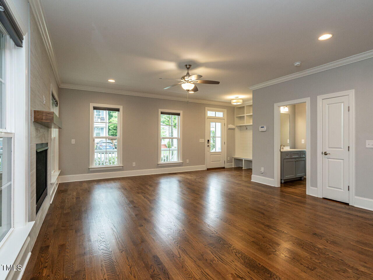 1506 East Jones Street Raleigh, NC 27610 - Photo 7 of 35 an empty room with wooden floor and windows