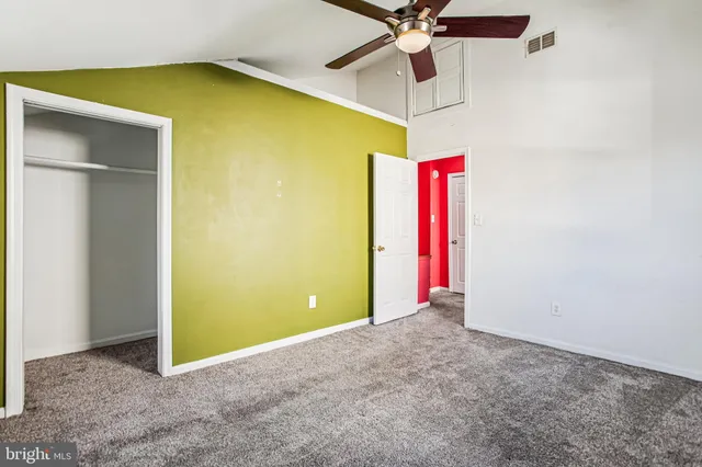 a bedroom with furniture and window