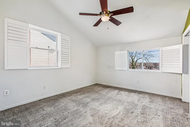 a view of empty room with windows