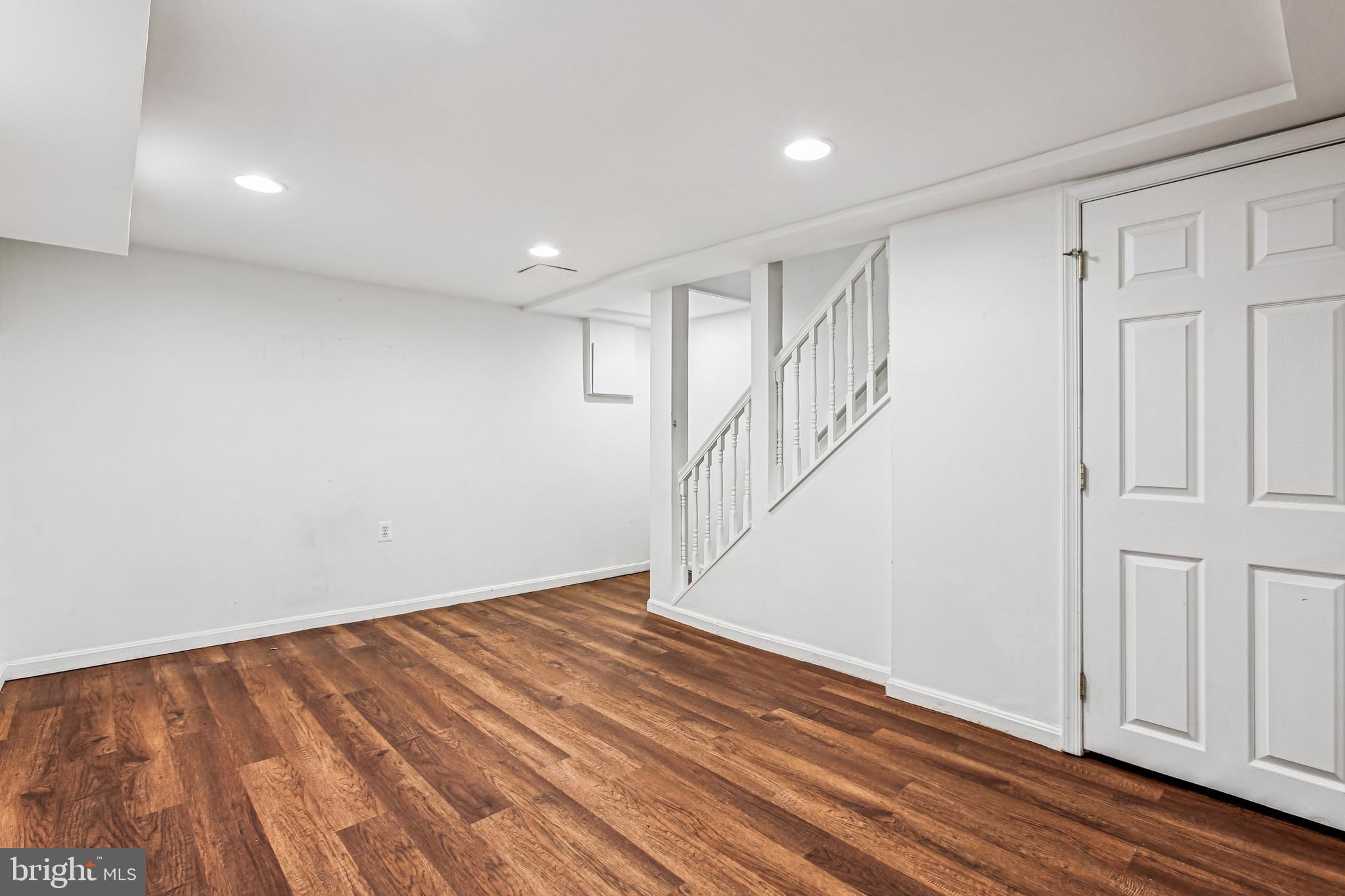 836 Division Avenue Northeast Washington, DC 20019 - Photo 25 of 36 a view of an empty room with wooden floor
