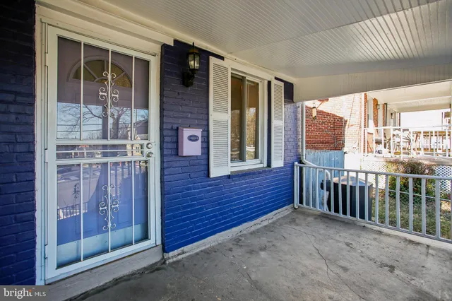 a view of a balcony with furniture