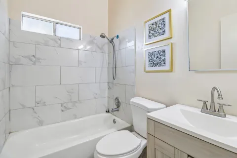 a bathroom with a toilet sink and bathtub