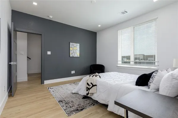 a bathroom with a double vanity sink a mirror and a shower