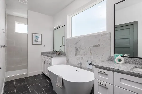 a bathroom with a bathtub and a sink