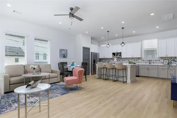 a living room with furniture and a large window