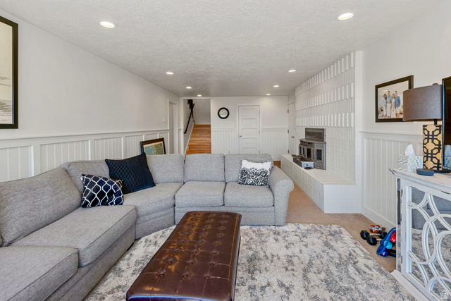 1900 North 100 East Provo, UT 84604 - Photo 28 of 49 Recessed lighting illuminating a spacious living area with white wainscoting and neutral carpeting