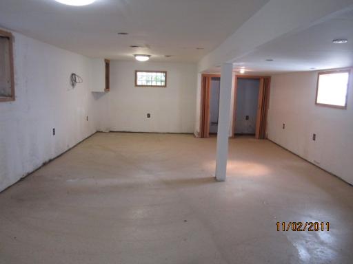 7418 West 63rd Place Summit, IL 60501 - Photo 8 of 9 a view of an empty room with a window