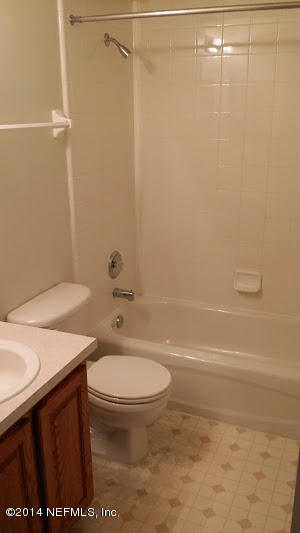 2750 Archer Street Middleburg, FL 32068 - Photo 11 of 34 a bathroom with a sink a toilet and shower