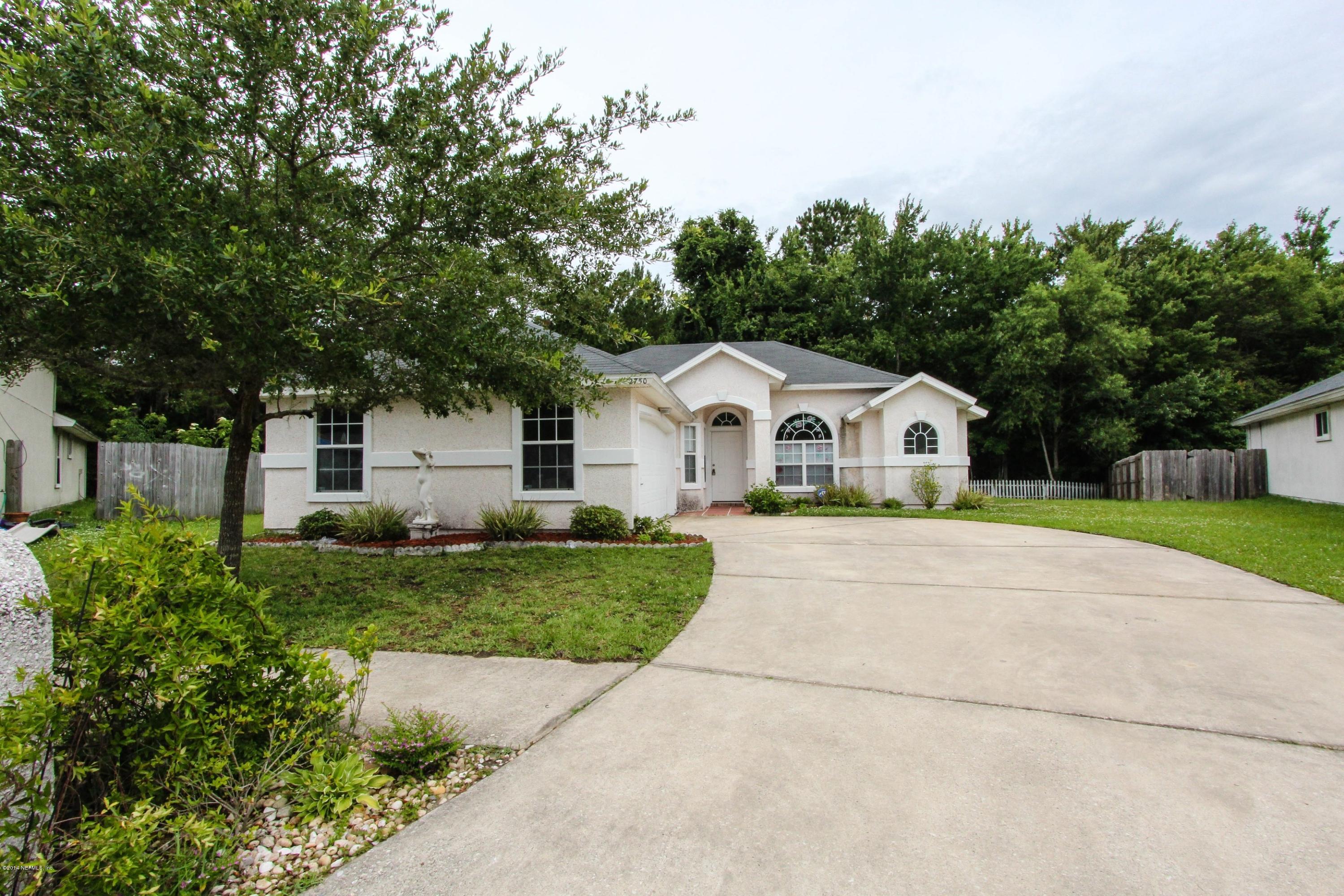 2750 Archer Street Middleburg, FL 32068 - Photo 14 of 34 a view of a white house with a yard