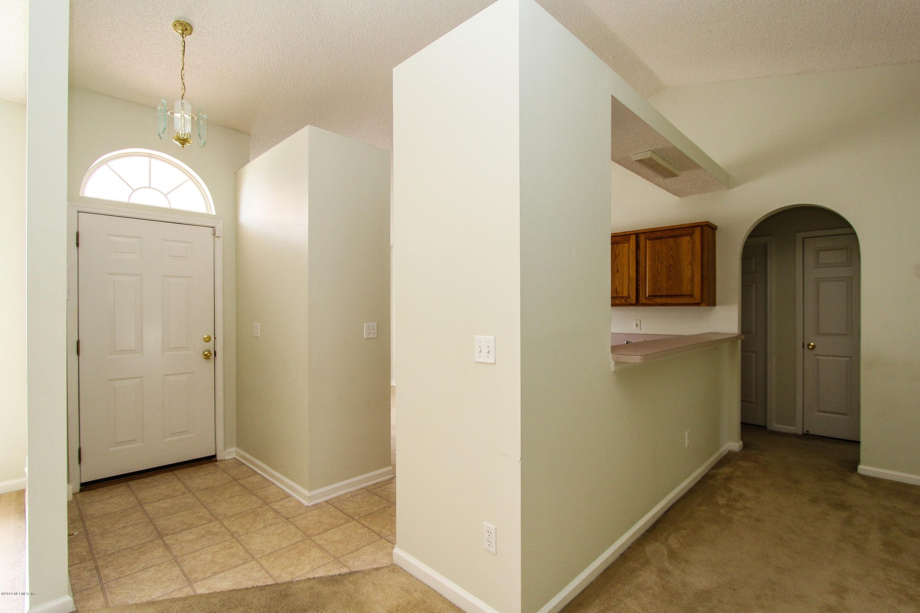 2750 Archer Street Middleburg, FL 32068 - Photo 16 of 34 a view of a bathroom with a sink and a mirror