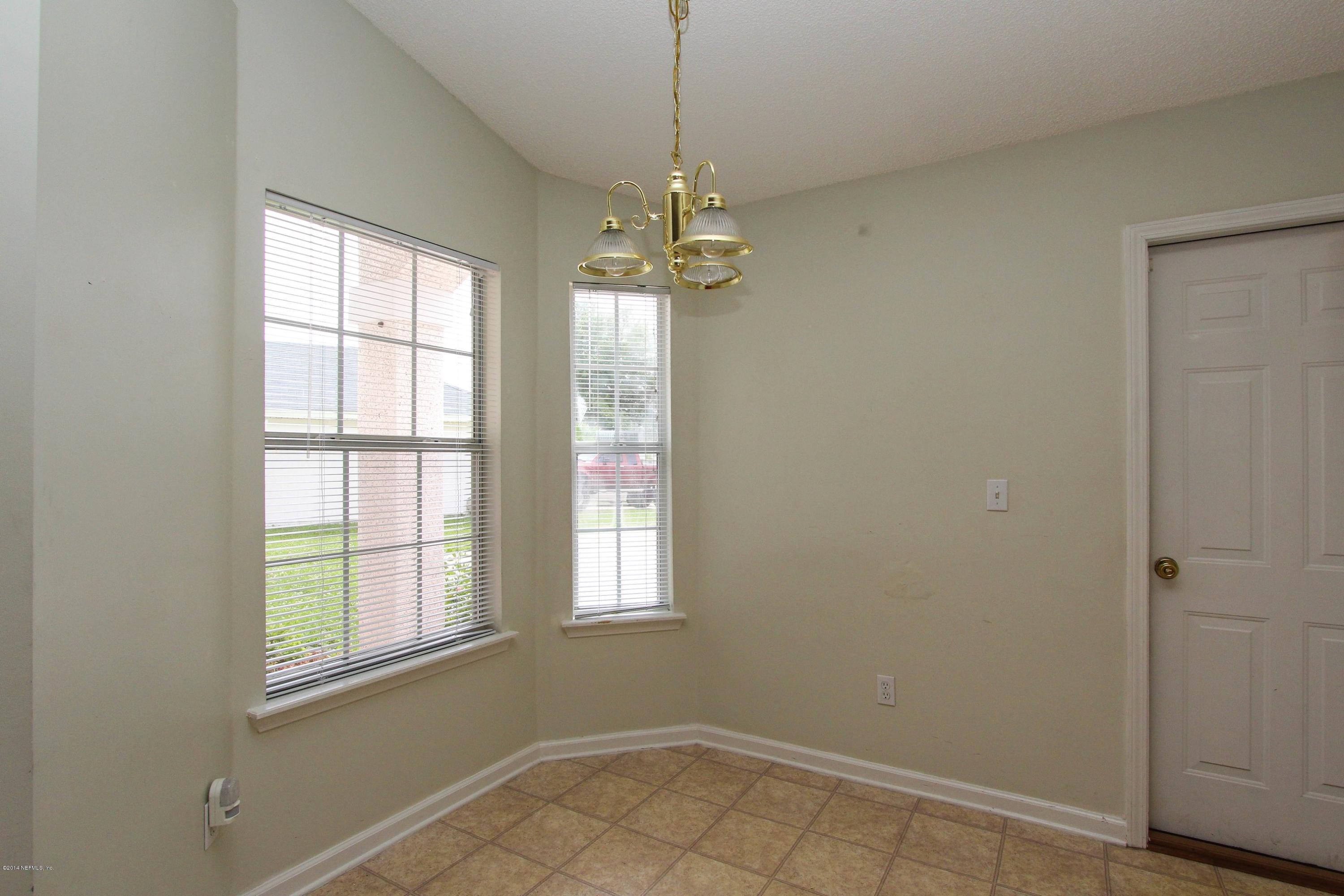 2750 Archer Street Middleburg, FL 32068 - Photo 22 of 34 wooden floor in an empty room with a window