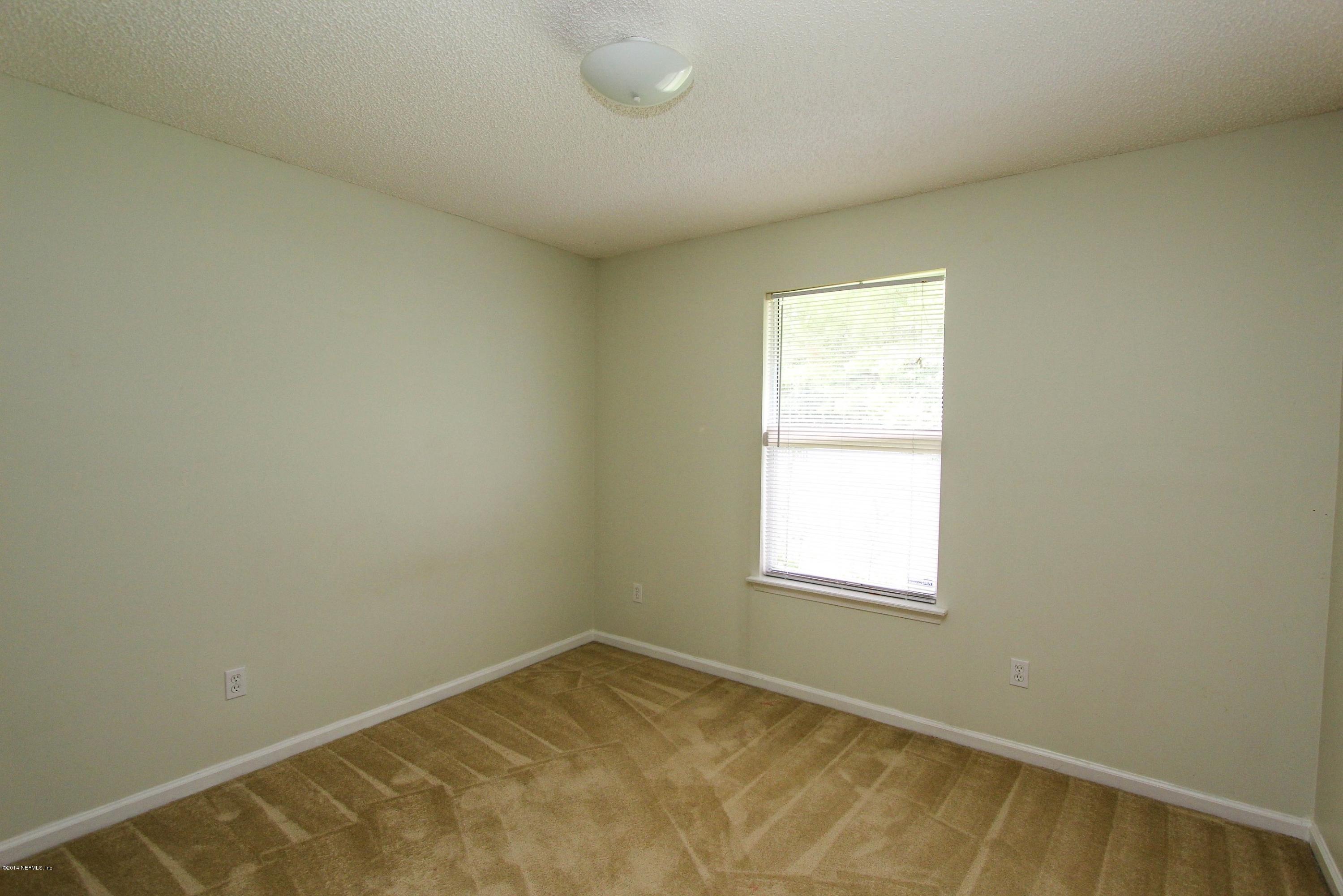 2750 Archer Street Middleburg, FL 32068 - Photo 25 of 34 an empty room with a window