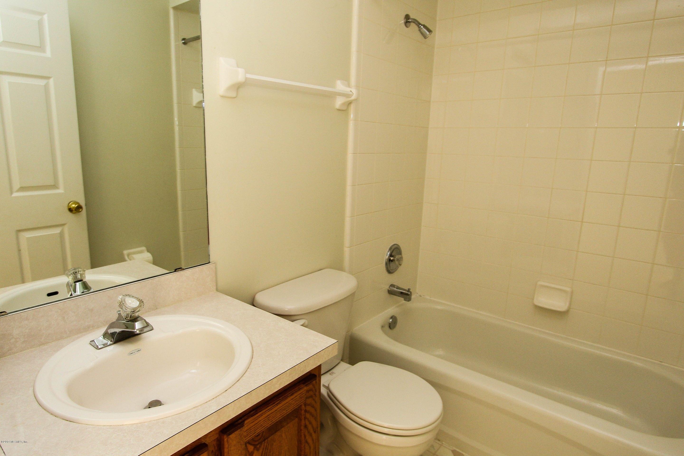 2750 Archer Street Middleburg, FL 32068 - Photo 27 of 34 a bathroom with a sink toilet and shower
