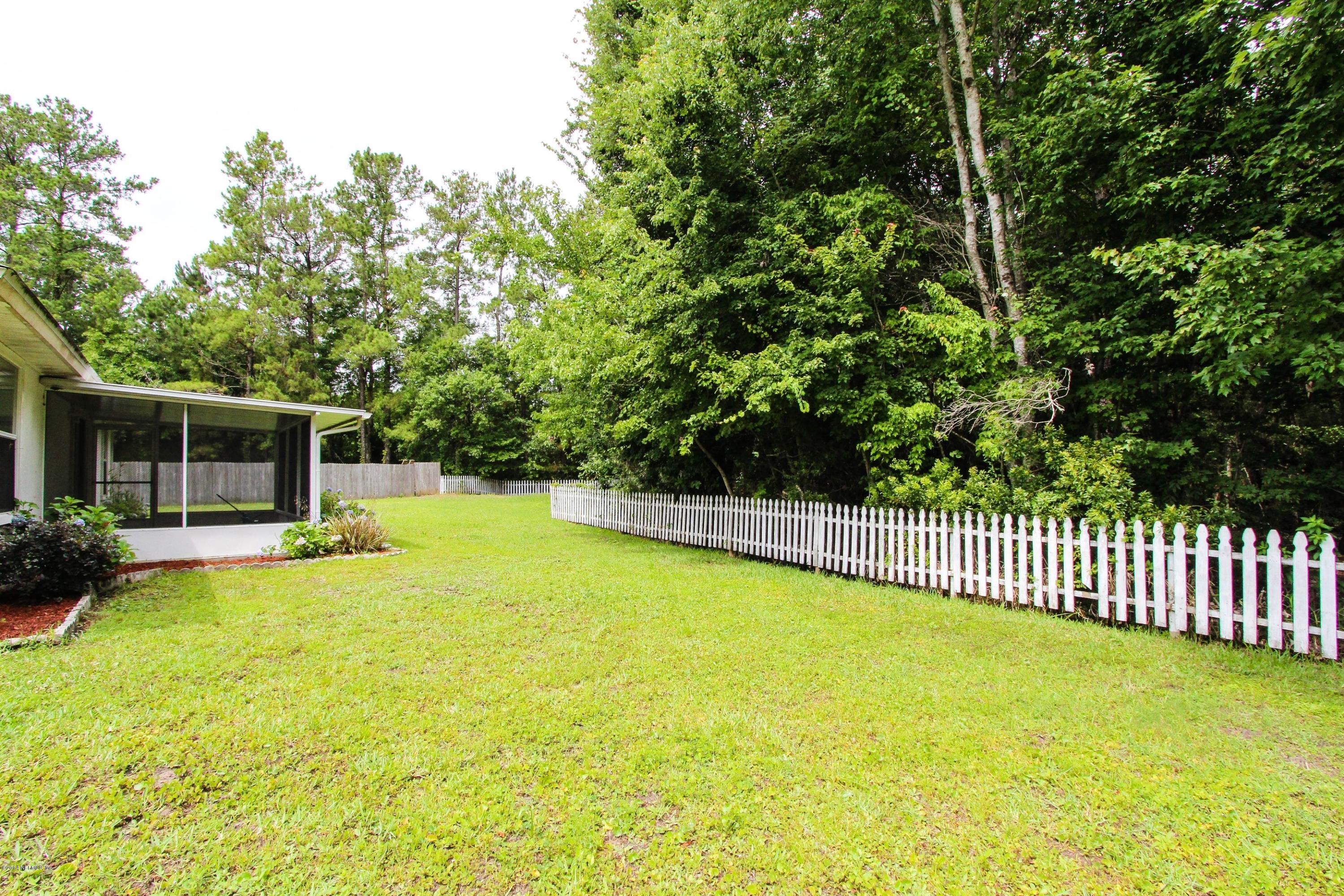 2750 Archer Street Middleburg, FL 32068 - Photo 33 of 34 a view of a backyard with swimming pool and furniture